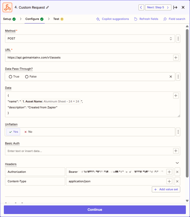 Screenshot showing the configuration for a custom Zapier action to create a MaintainX asset